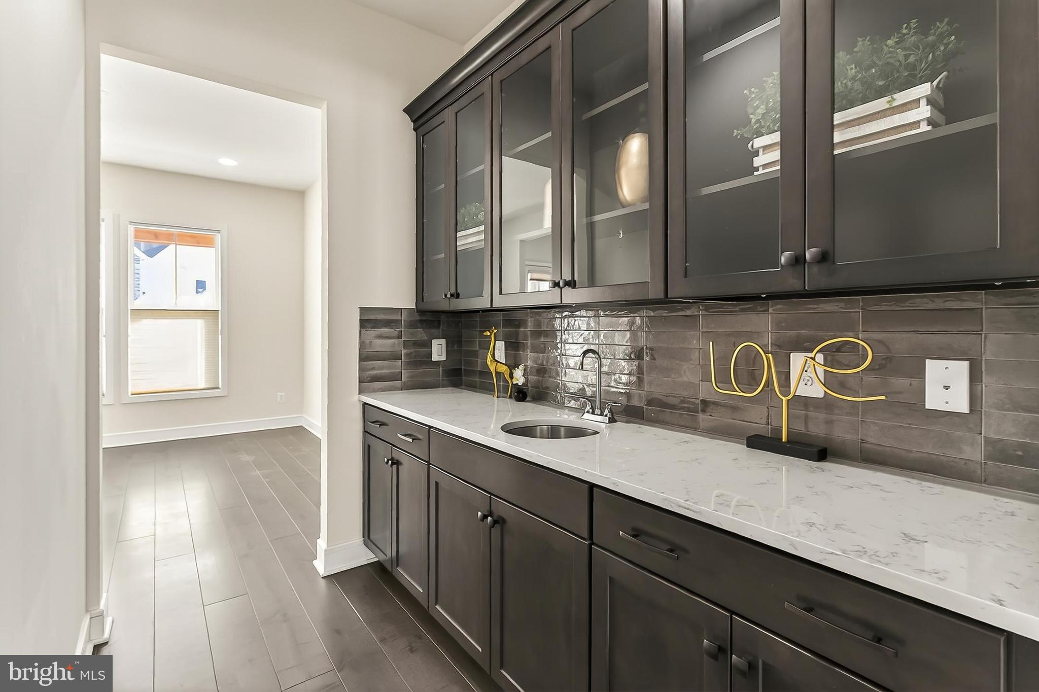 41424 Gentle Wind Place Aldie, VA 20105 - Photo 30 of 83 a kitchen with a sink and cabinets