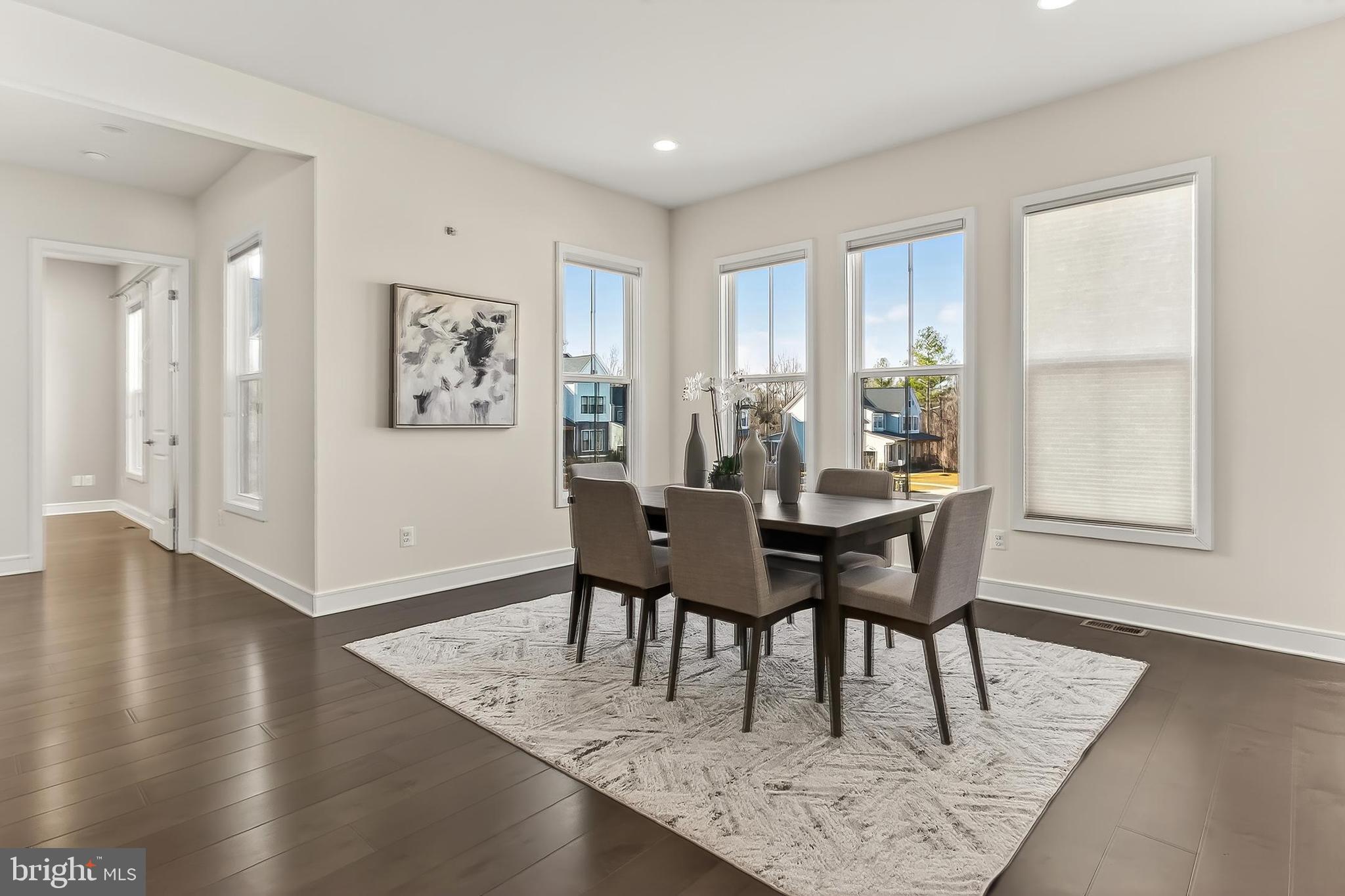 41424 Gentle Wind Place Aldie, VA 20105 - Photo 31 of 83 a view of a dining room with furniture and wooden floor