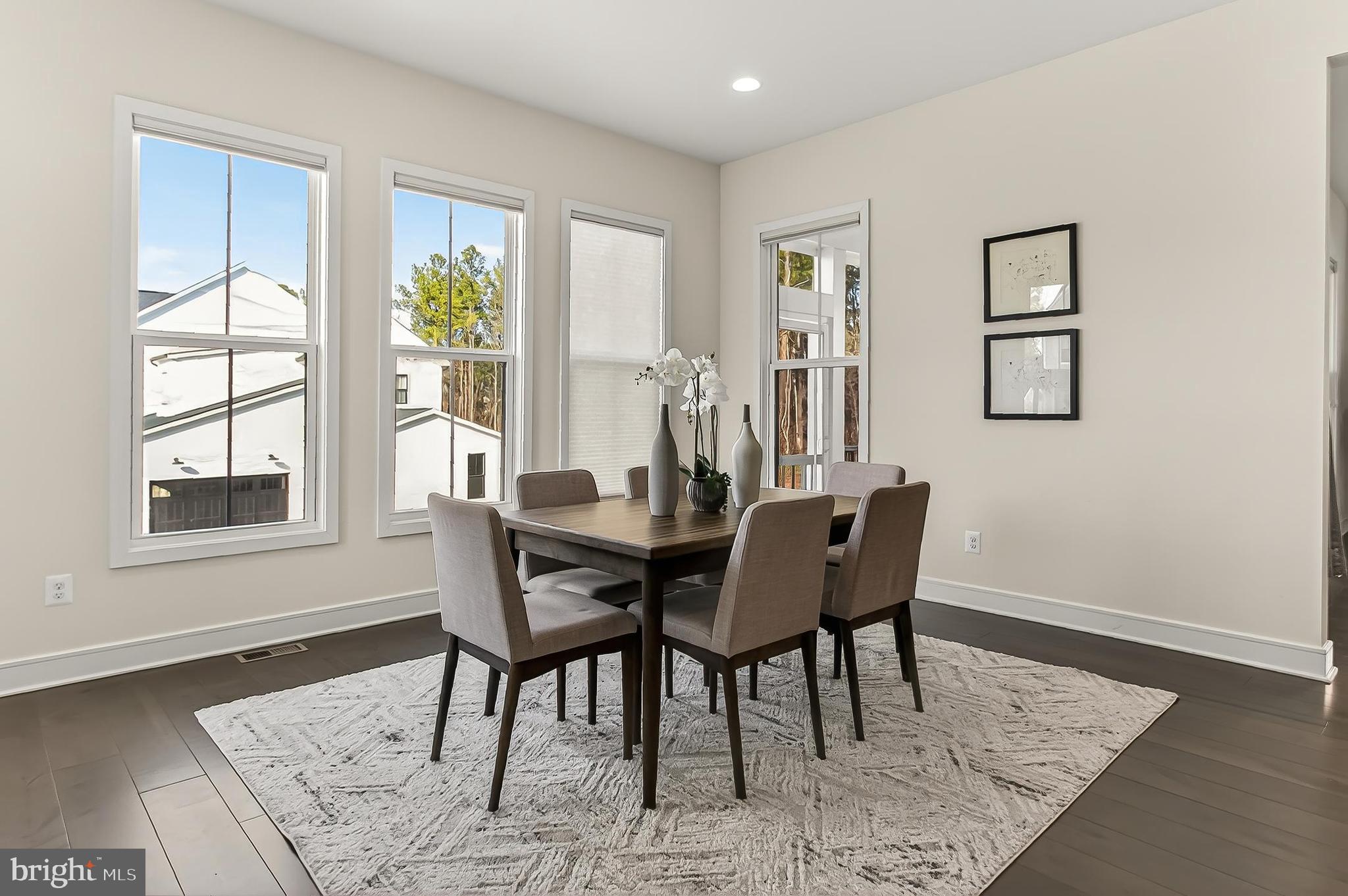 41424 Gentle Wind Place Aldie, VA 20105 - Photo 32 of 83 a view of a dining room with furniture and wooden floor