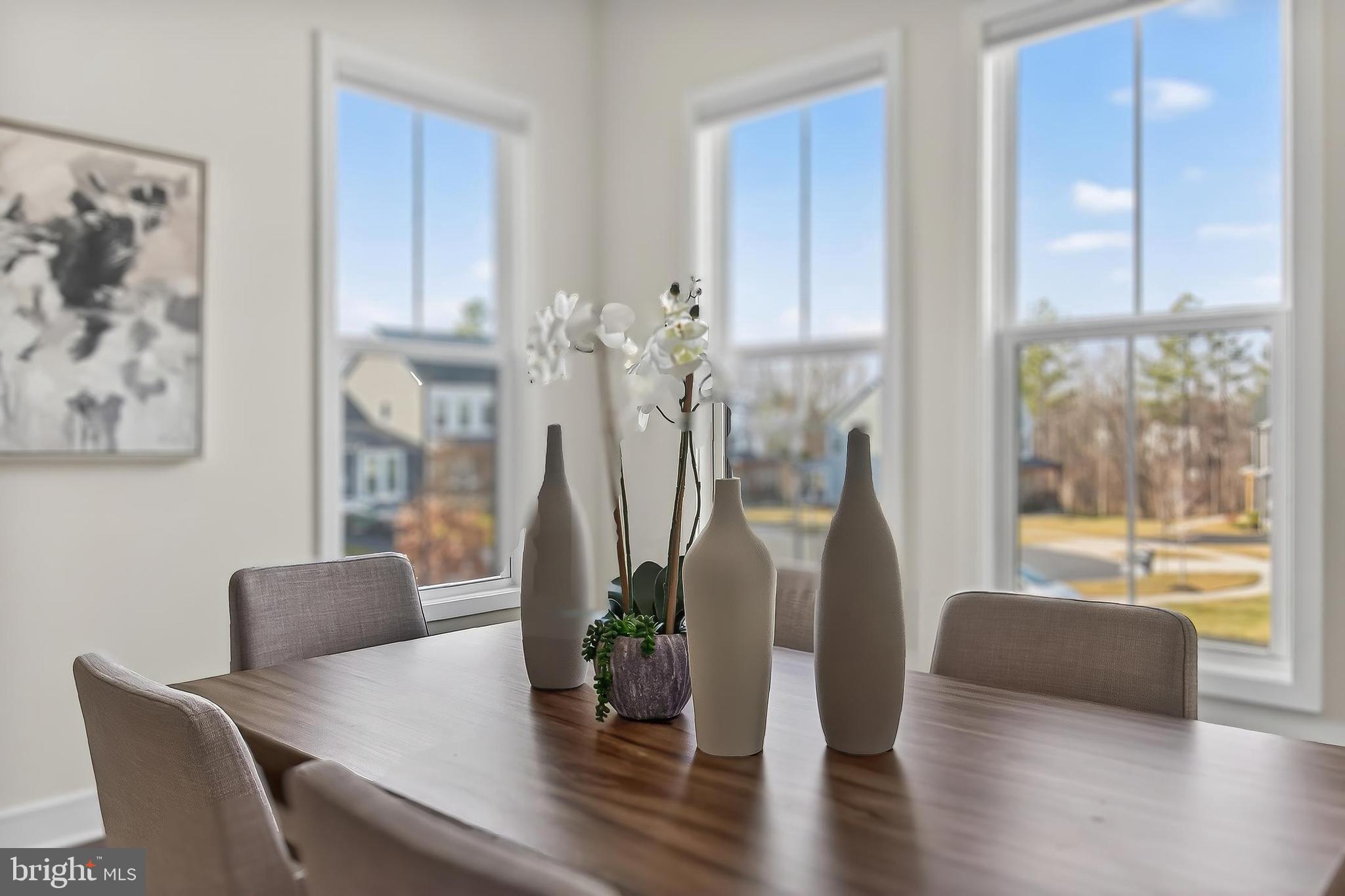 41424 Gentle Wind Place Aldie, VA 20105 - Photo 33 of 83 a view of a dining room with furniture window and wooden floor