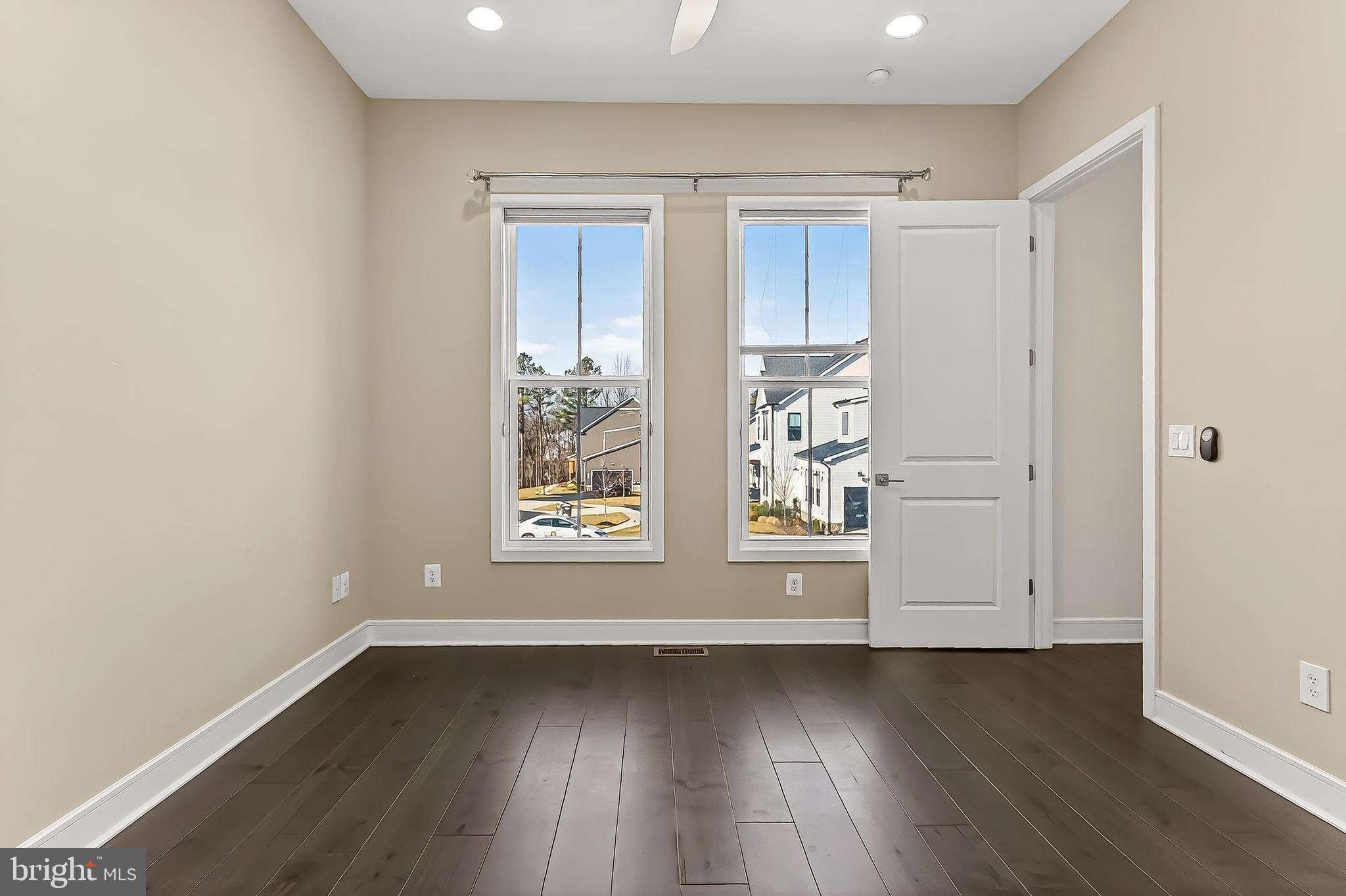 41424 Gentle Wind Place Aldie, VA 20105 - Photo 37 of 83 an empty room with wooden floor and windows