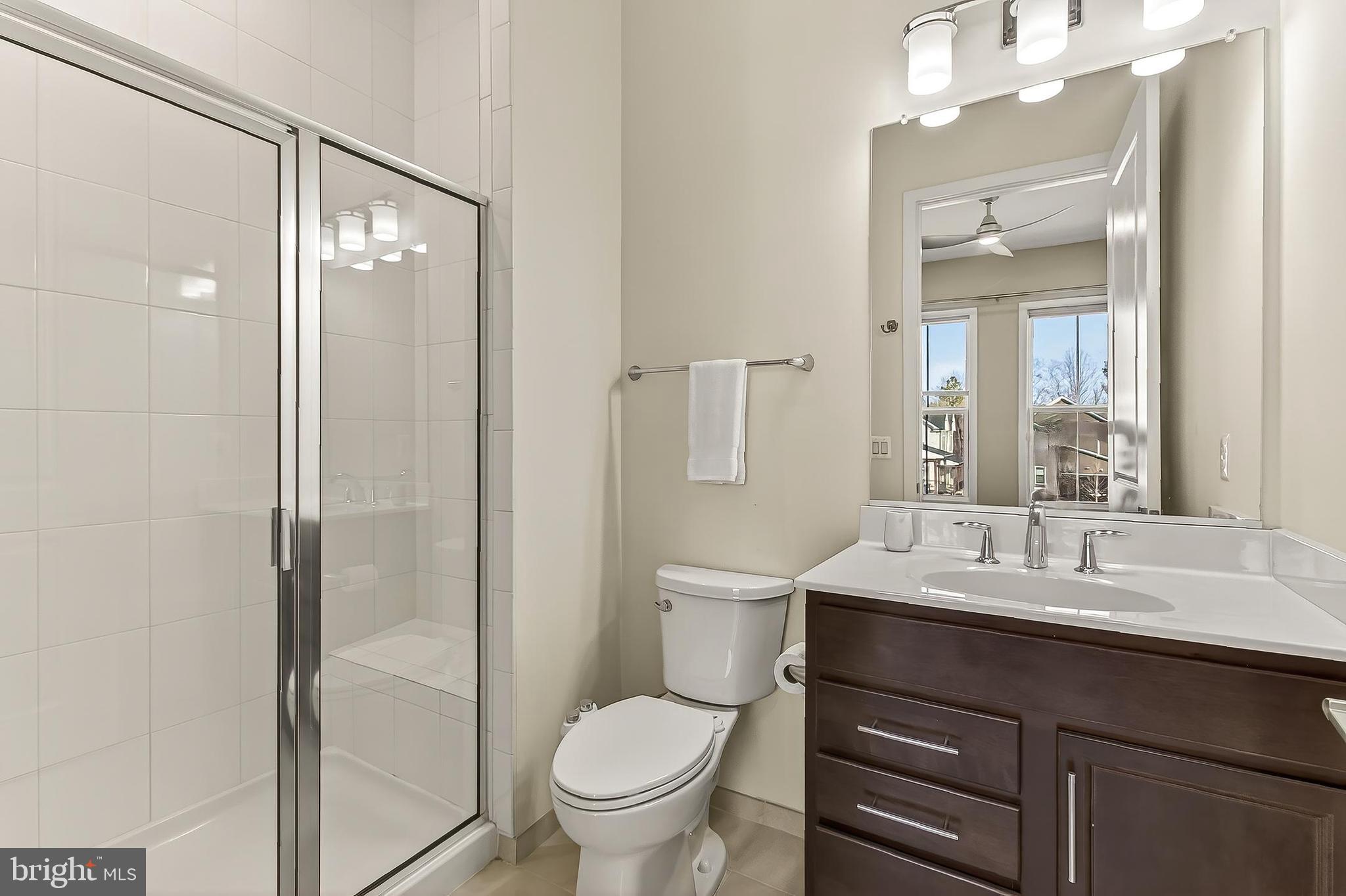41424 Gentle Wind Place Aldie, VA 20105 - Photo 38 of 83 a bathroom with a sink toilet and shower