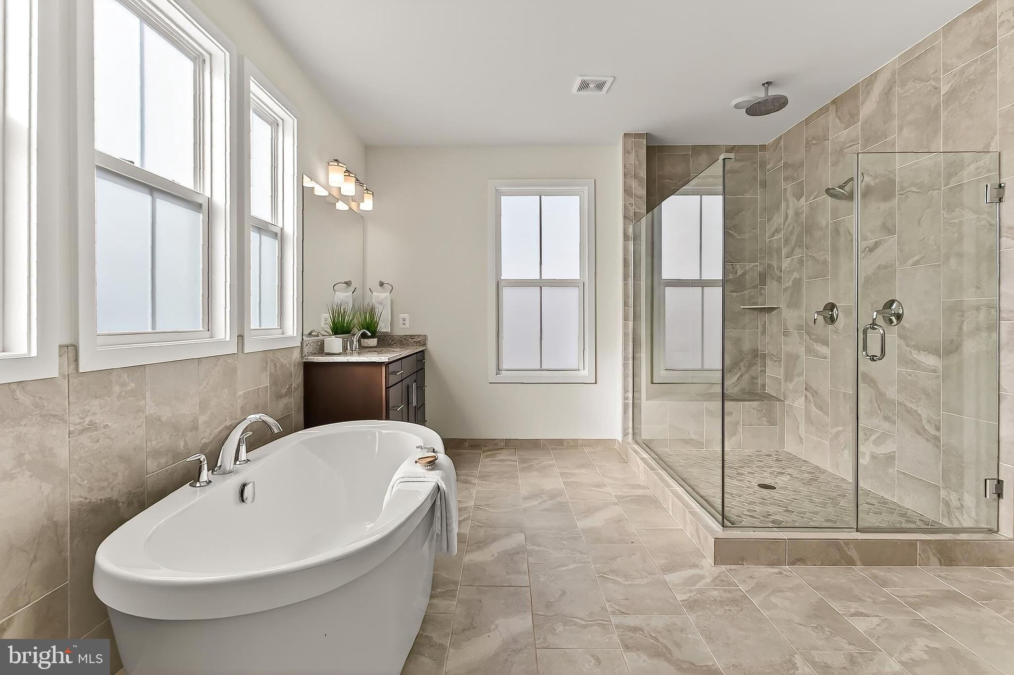 41424 Gentle Wind Place Aldie, VA 20105 - Photo 46 of 83 a bathroom with a sink and a bathtub