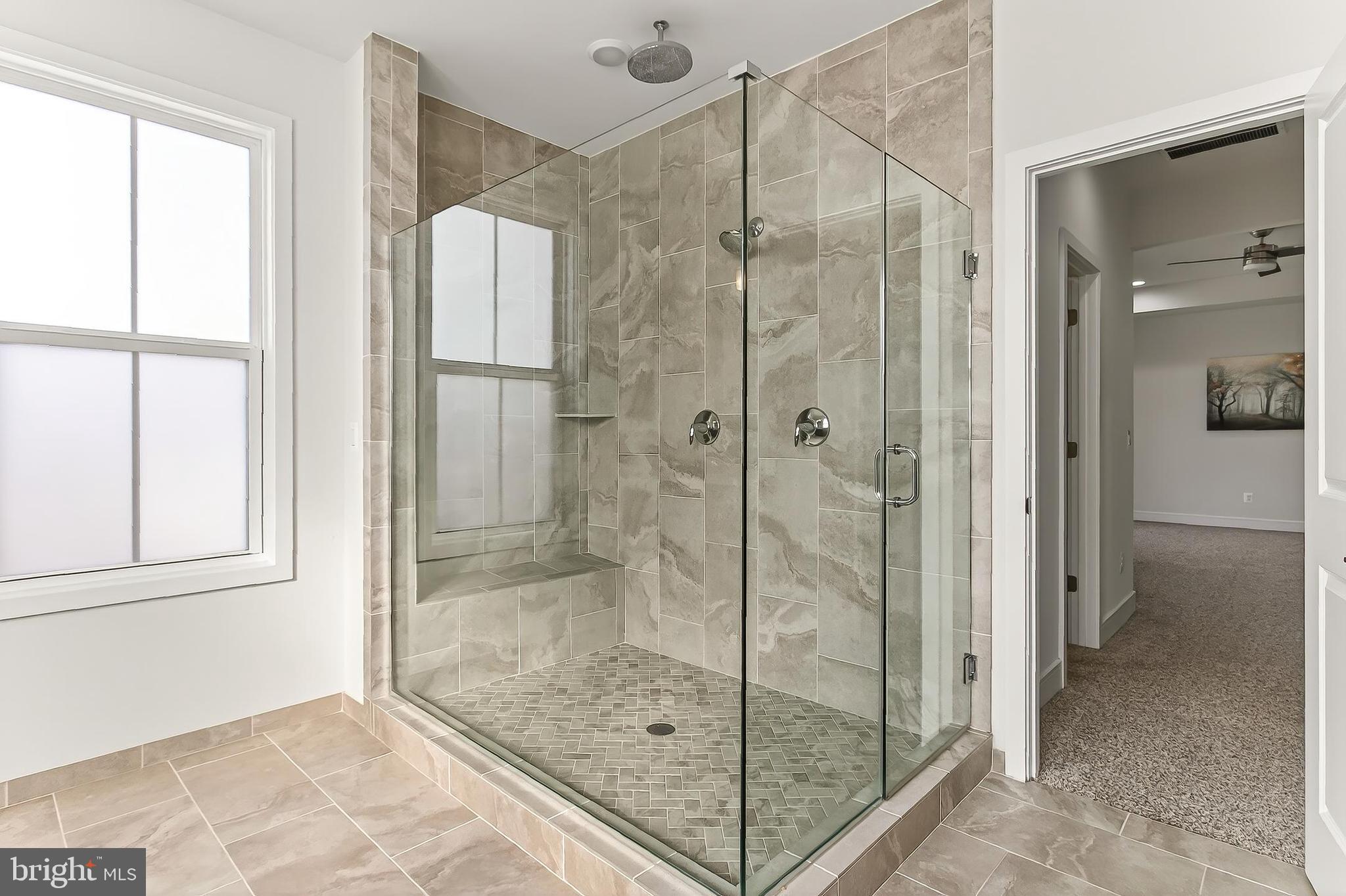 41424 Gentle Wind Place Aldie, VA 20105 - Photo 47 of 83 a bathroom that has a glass shower door
