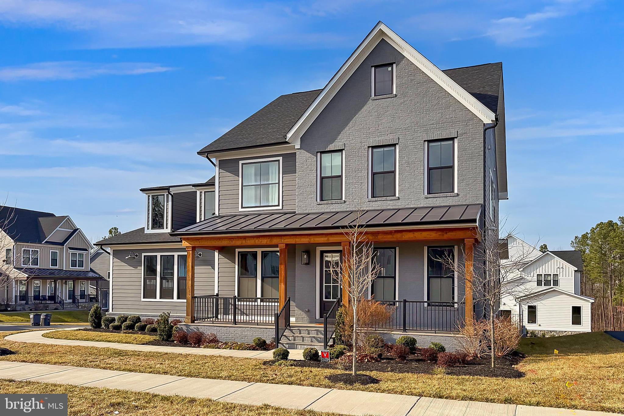41424 Gentle Wind Place Aldie, VA 20105 - Photo 5 of 83 a front view of a house with a yard