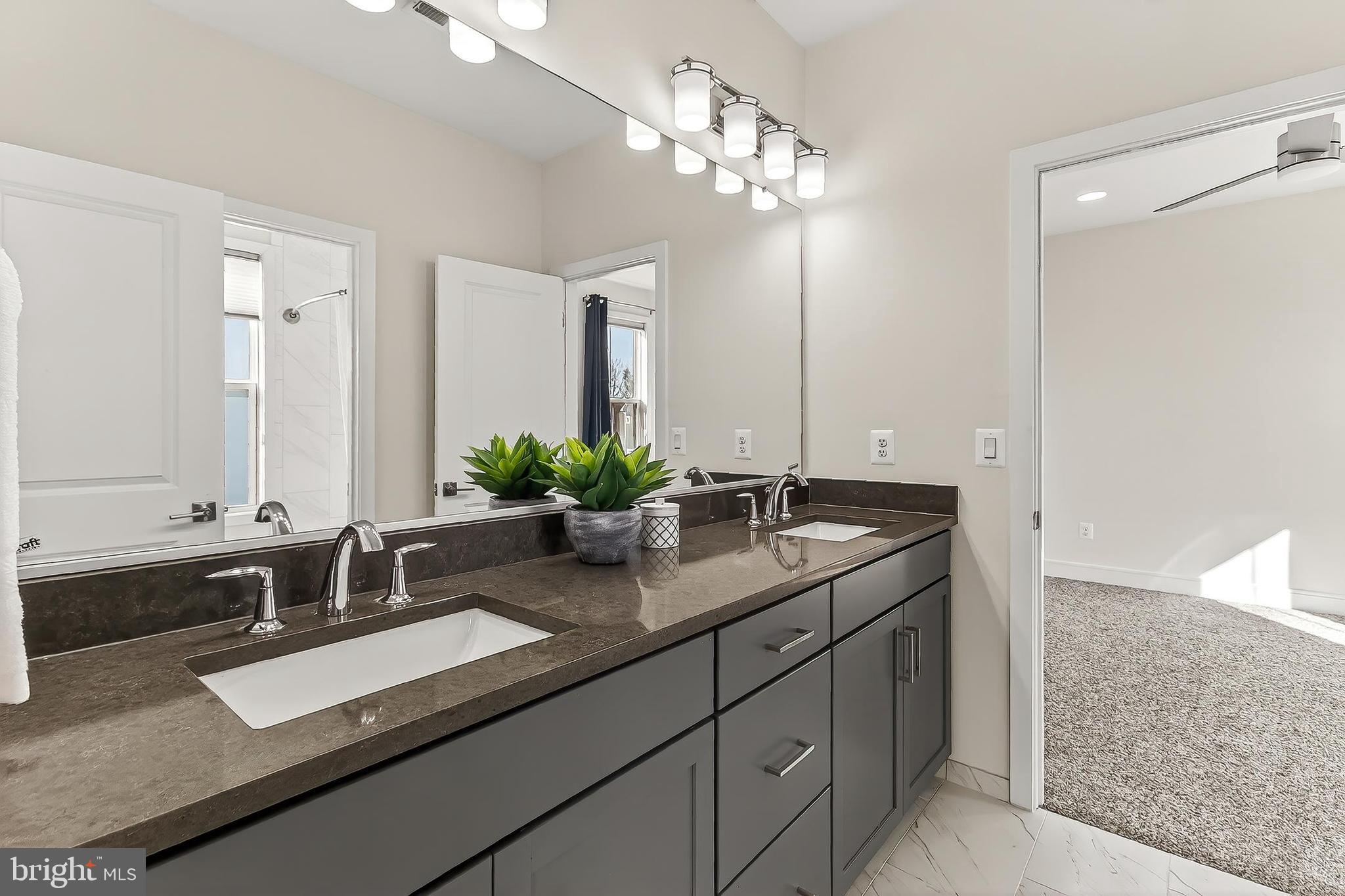 41424 Gentle Wind Place Aldie, VA 20105 - Photo 54 of 83 a bathroom with double sink and a mirror