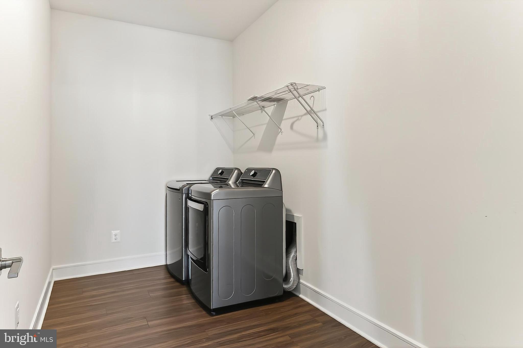 41424 Gentle Wind Place Aldie, VA 20105 - Photo 57 of 83 a utility room with wooden floor washer and dryer