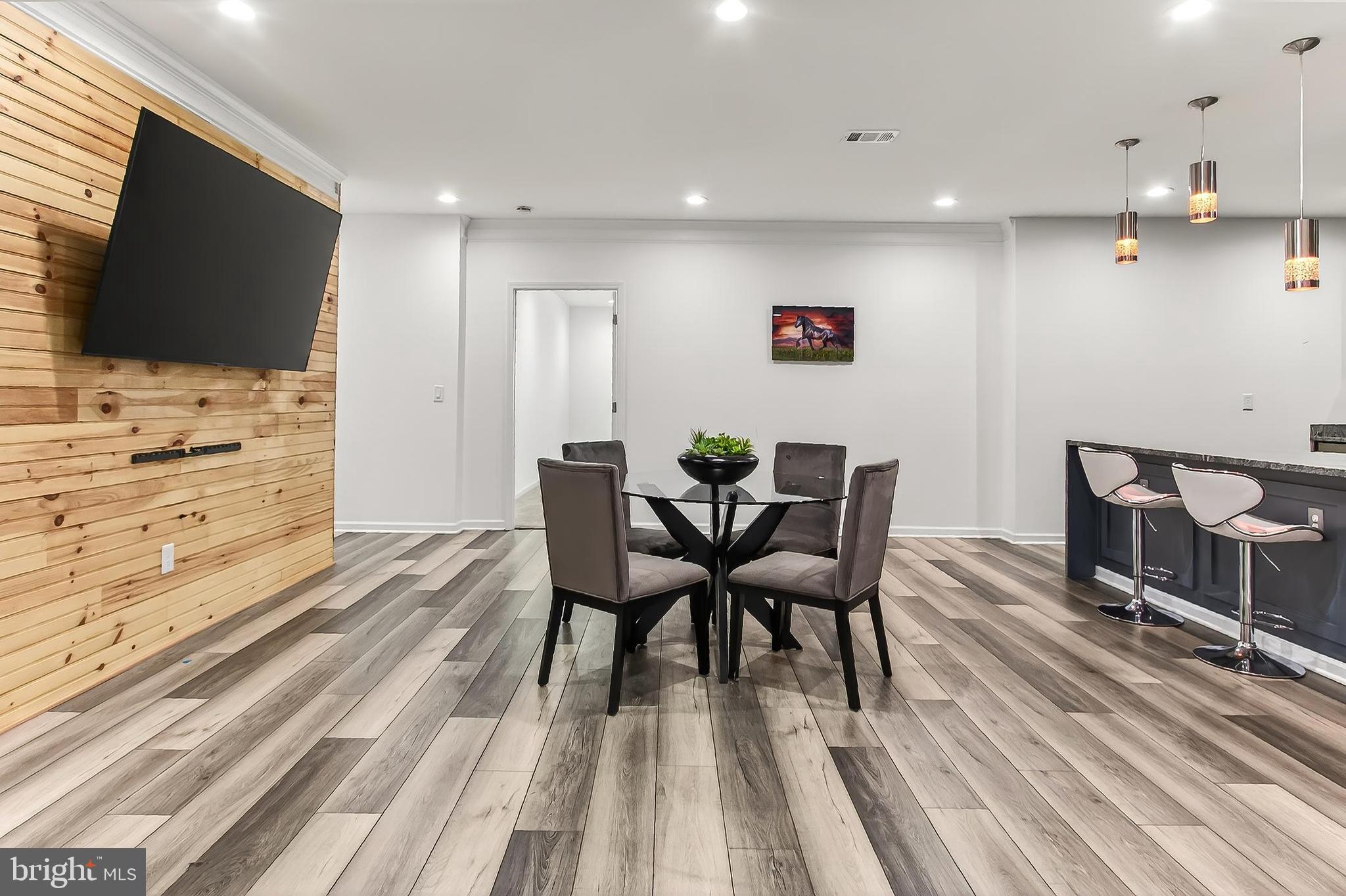 41424 Gentle Wind Place Aldie, VA 20105 - Photo 60 of 83 a view of a dining room with furniture and wooden floor