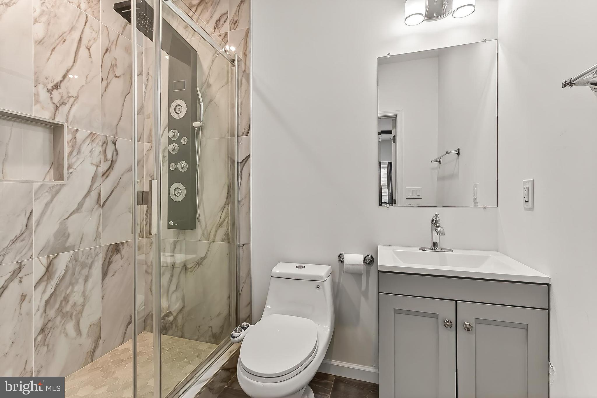 41424 Gentle Wind Place Aldie, VA 20105 - Photo 72 of 83 a bathroom with a sink toilet and shower