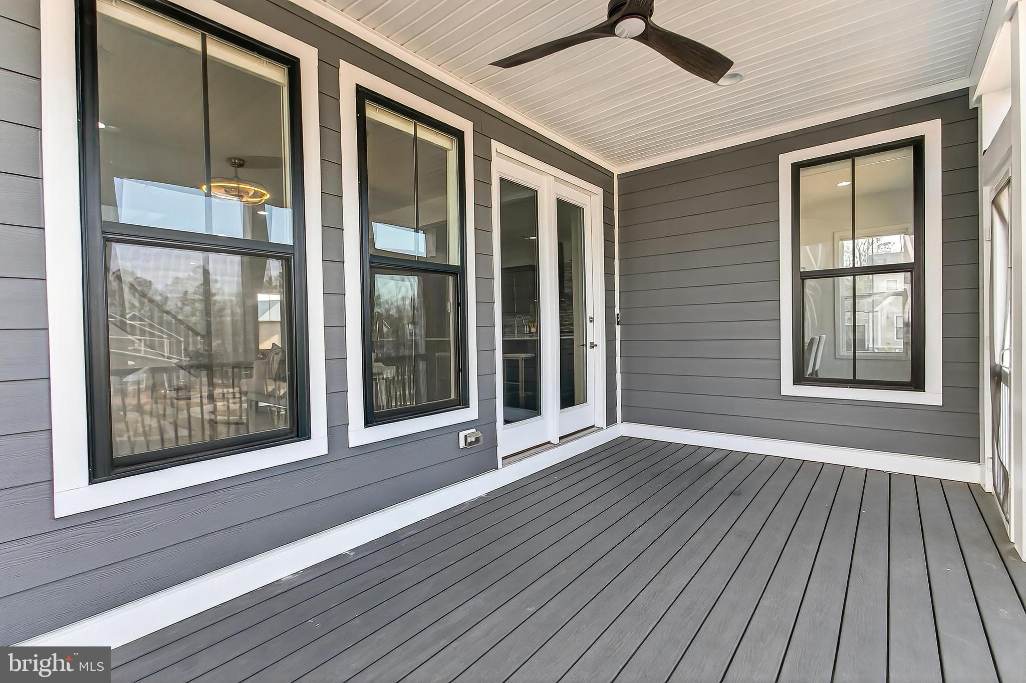 41424 Gentle Wind Place Aldie, VA 20105 - Photo 76 of 83 an empty room with wooden floor and windows