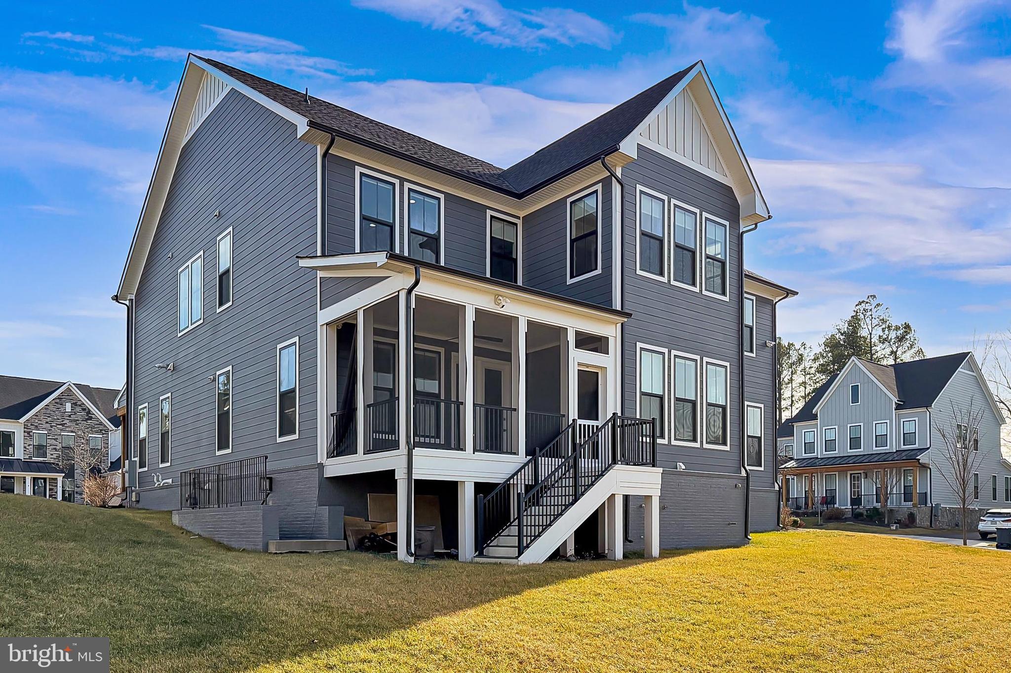 41424 Gentle Wind Place Aldie, VA 20105 - Photo 80 of 83 a front view of a house with a yard balcony