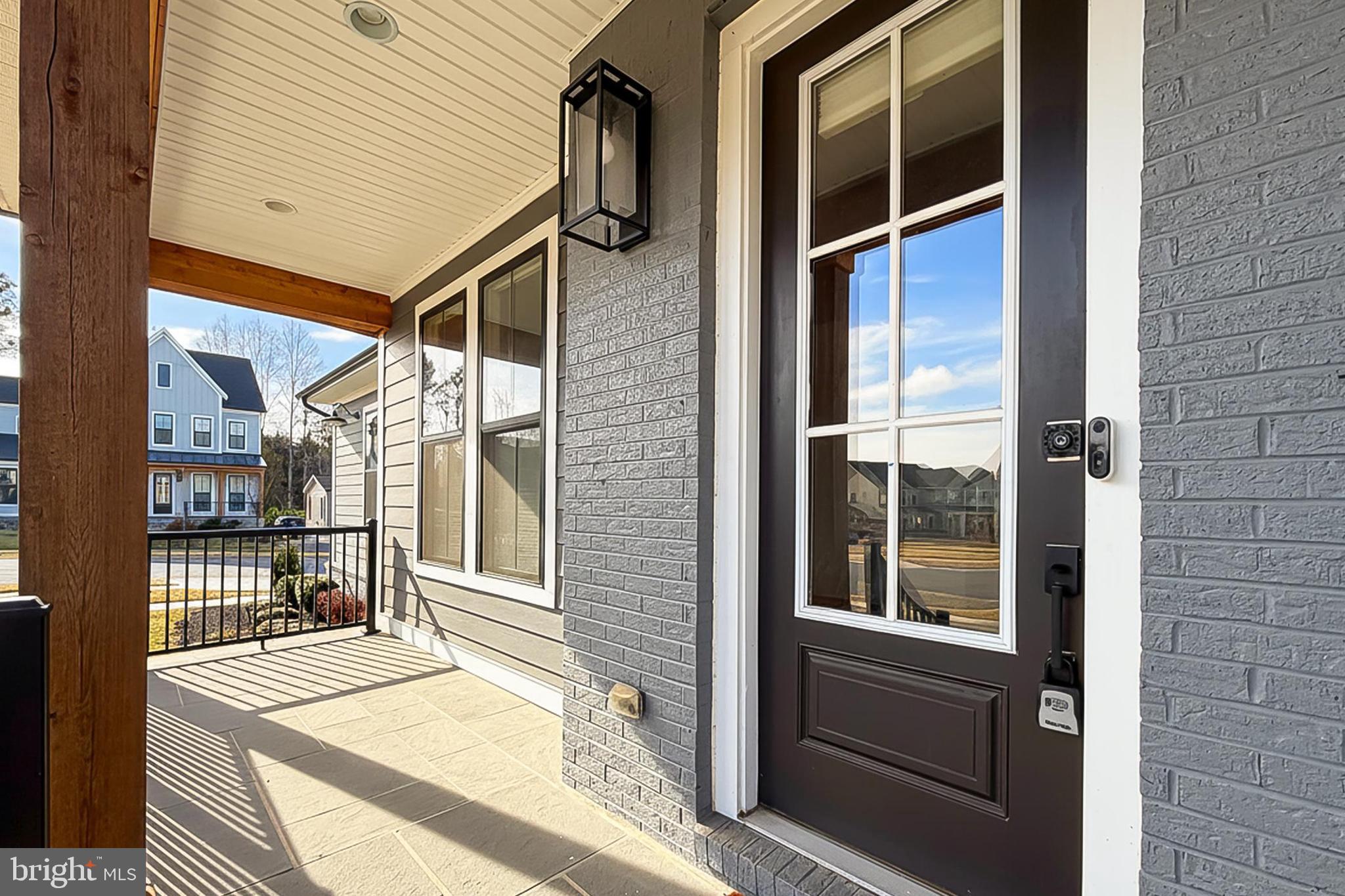 41424 Gentle Wind Place Aldie, VA 20105 - Photo 8 of 83 a balcony view with a large window and wooden floor