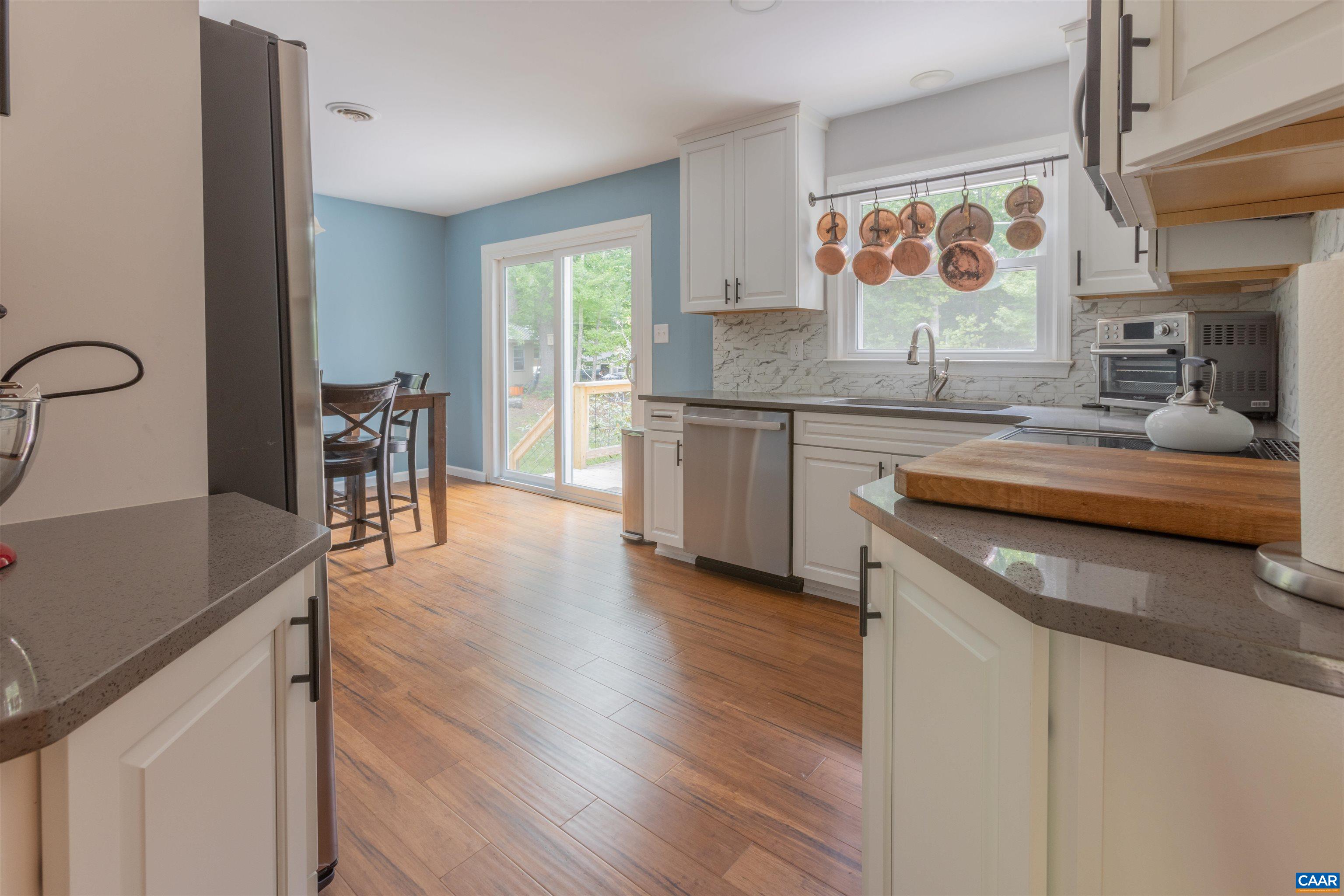 2550 Proffit Road Charlottesville, VA 22911 - Photo 4 of 41 a kitchen with stainless steel appliances granite countertop sink stove top oven and cabinets
