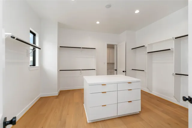 a room with a sink and a mirror