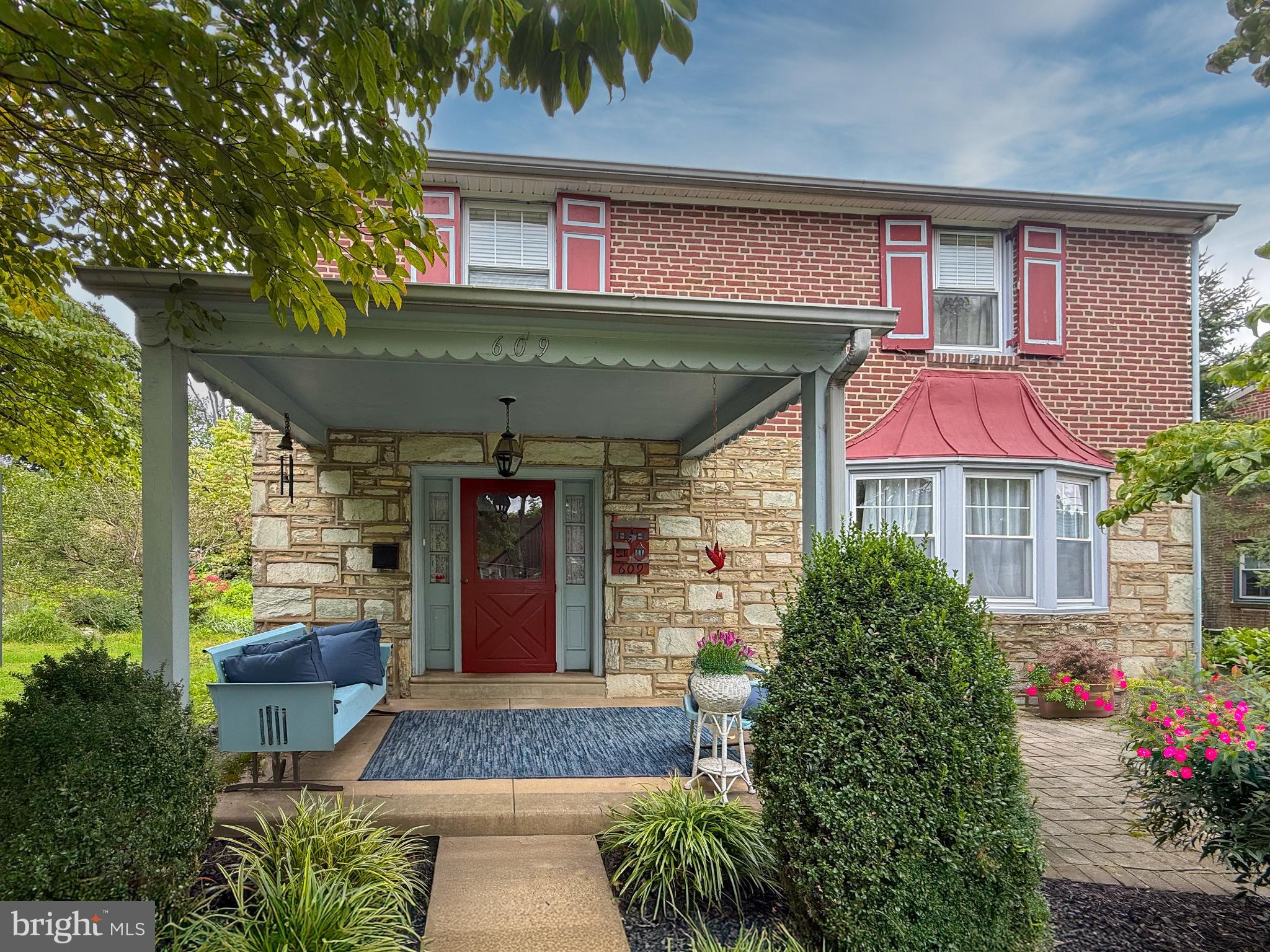 609 Boyer Road Cheltenham, PA 19012 - Photo 1 of 24 a front view of a house with garden