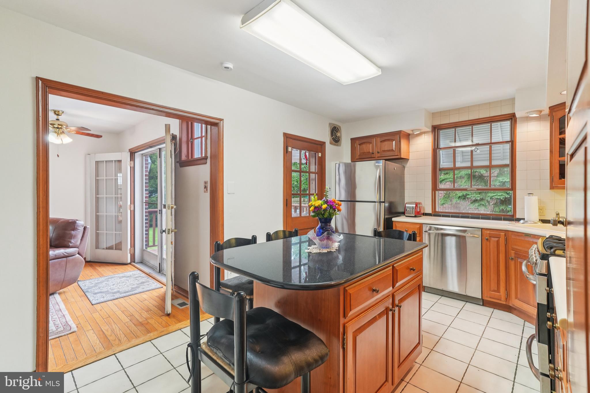 609 Boyer Road Cheltenham, PA 19012 - Photo 13 of 24 a kitchen with a table chairs sink and cabinets