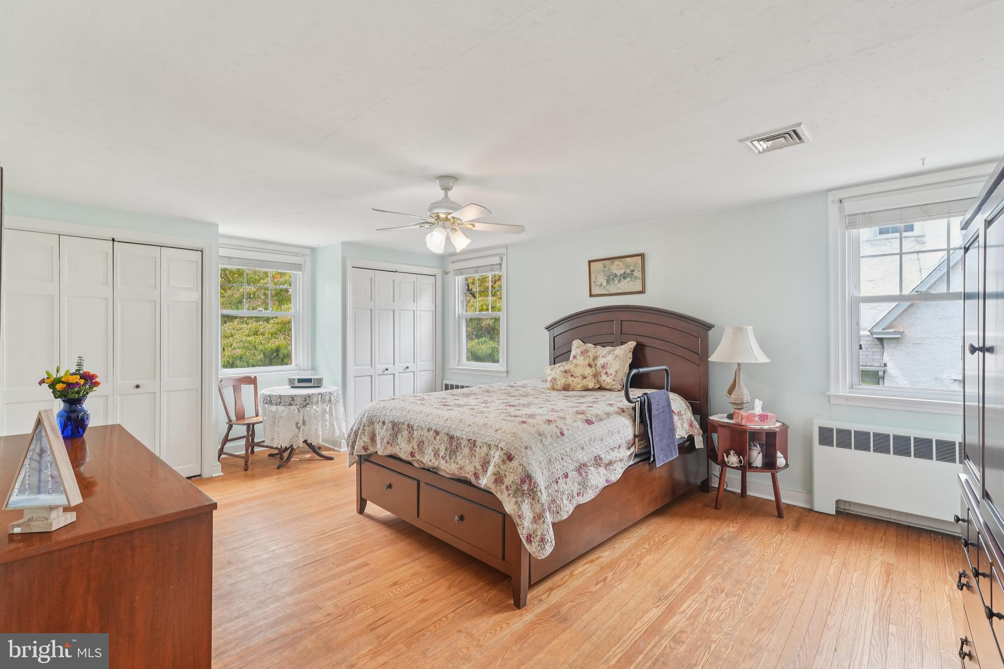609 Boyer Road Cheltenham, PA 19012 - Photo 17 of 24 a spacious bedroom with a bed and a table chair