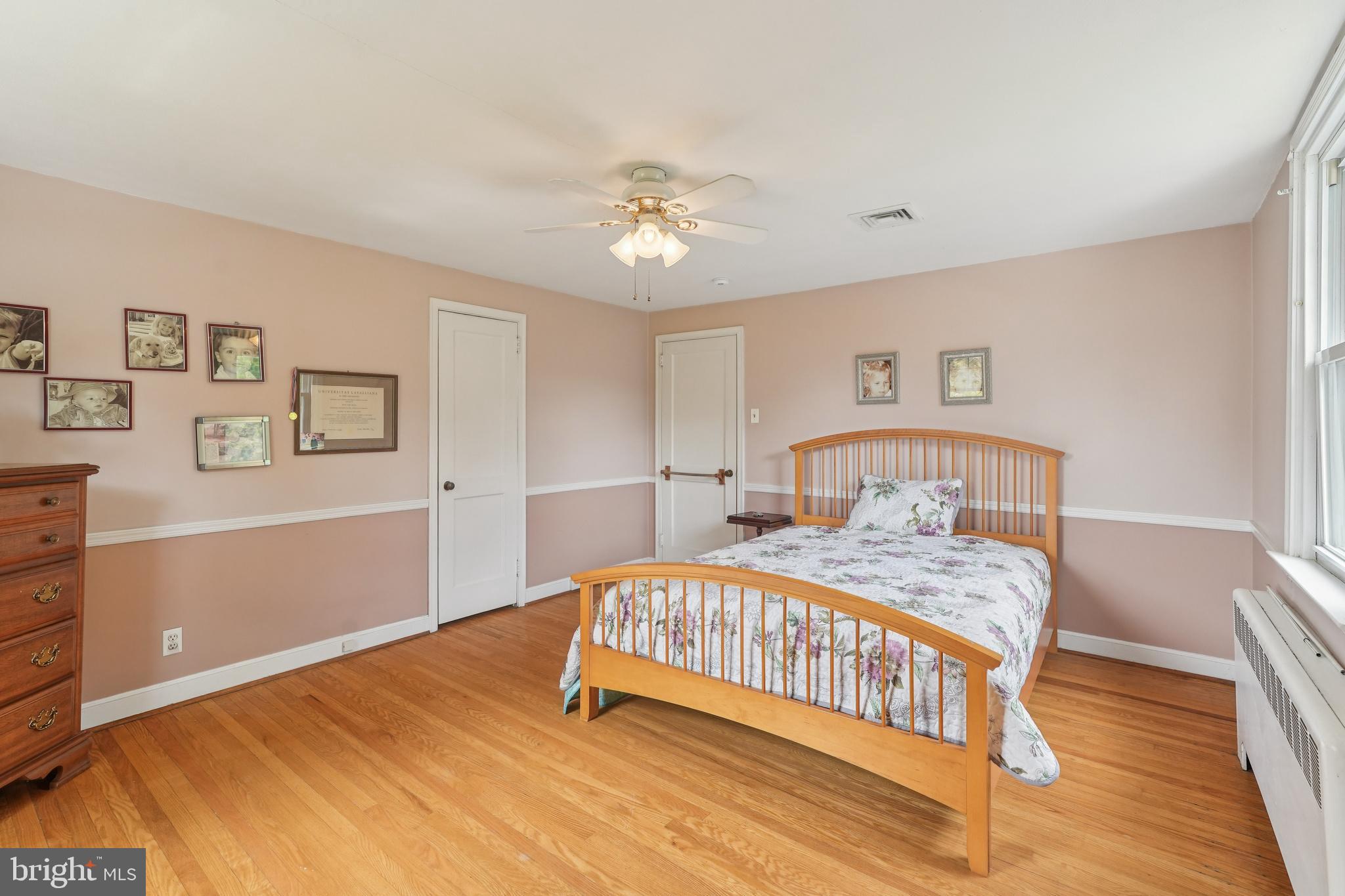 609 Boyer Road Cheltenham, PA 19012 - Photo 20 of 24 a bedroom with a bed and a chandelier