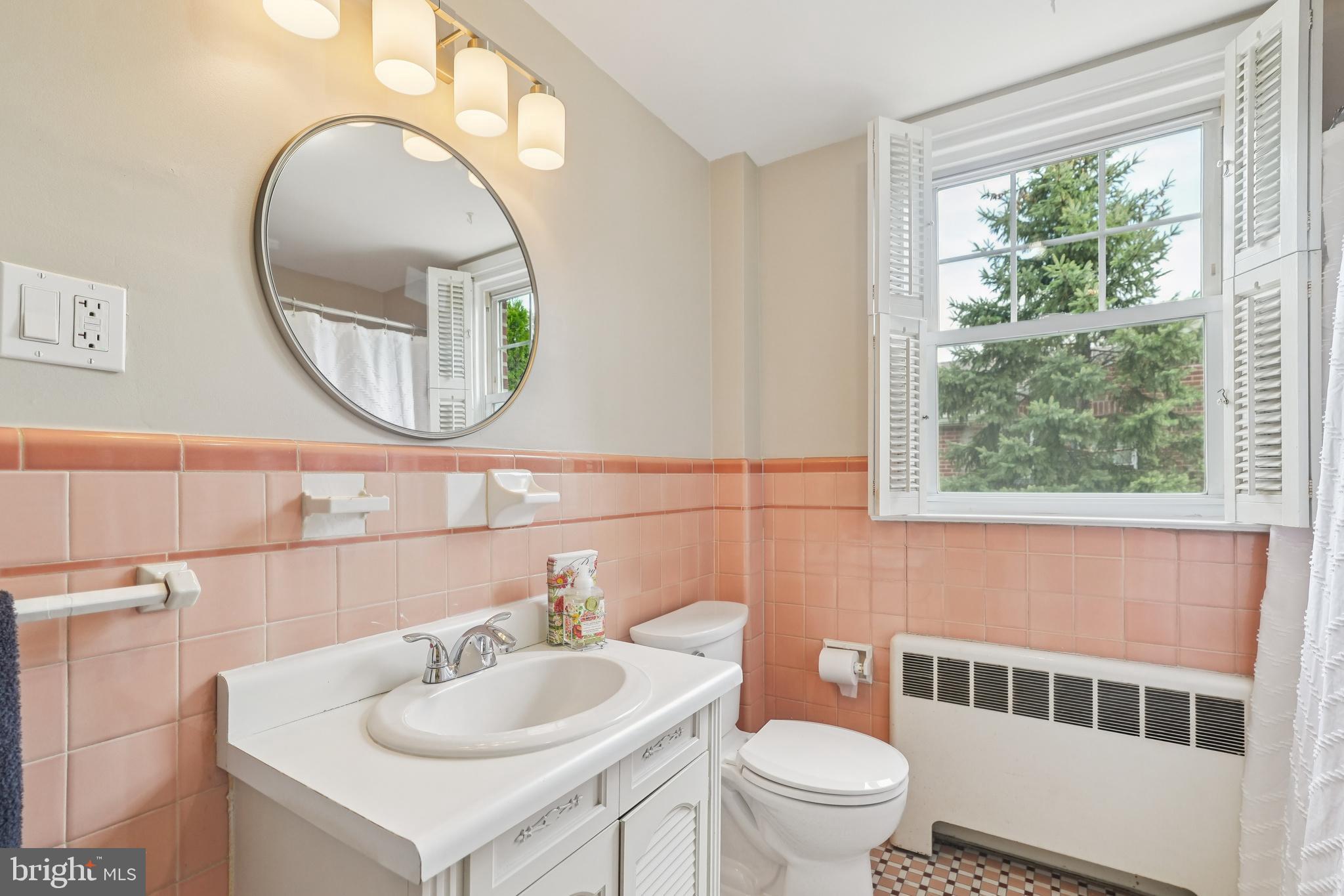 609 Boyer Road Cheltenham, PA 19012 - Photo 21 of 24 a bathroom with a toilet a sink and a mirror