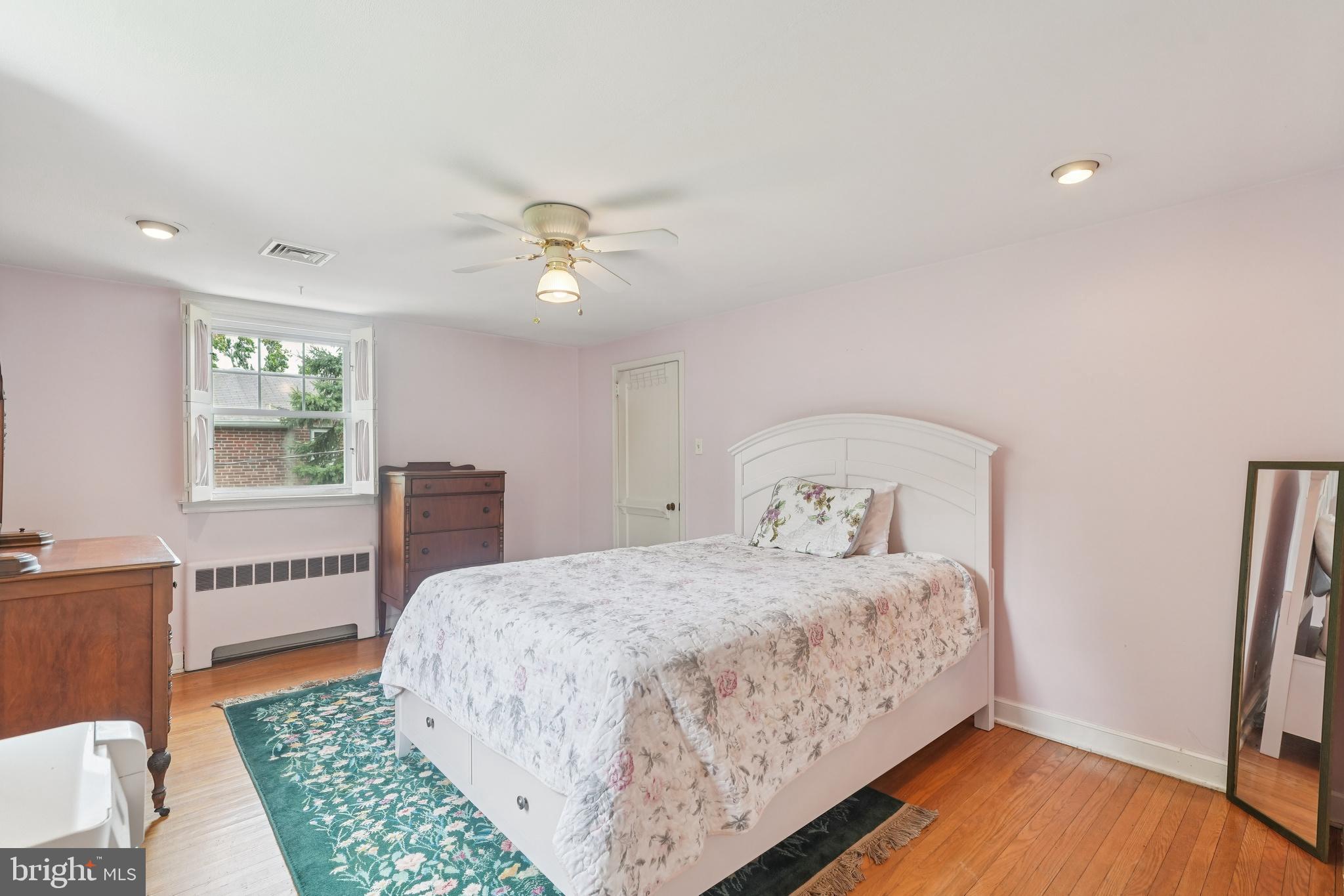 609 Boyer Road Cheltenham, PA 19012 - Photo 22 of 24 a bedroom with a bed and a table in it