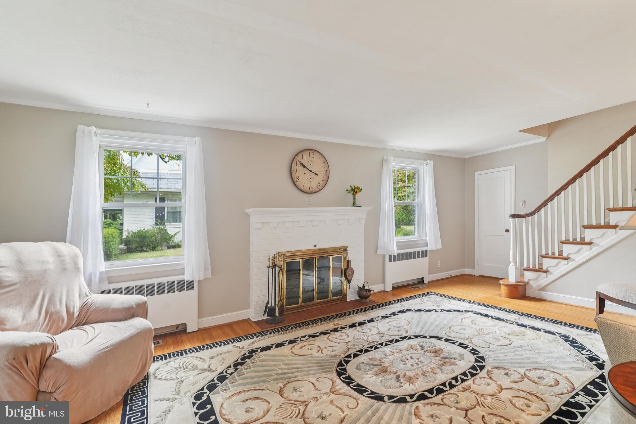 609 Boyer Road Cheltenham, PA 19012 - Photo 9 of 24 a living room with furniture windows and a fireplace