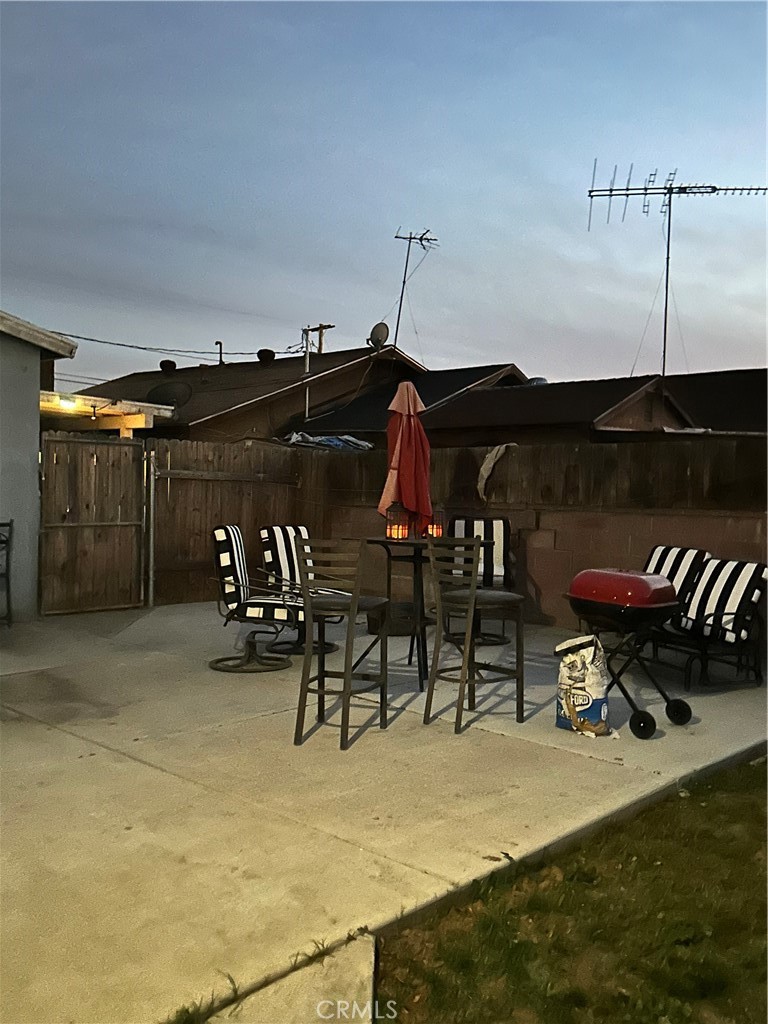 7459 Ysmael Villegas Street Riverside, CA 92504 - Photo 2 of 8 a view of a chairs and table in patio