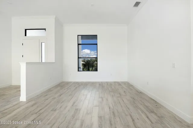 a view of kitchen with cabinets and wooden floor