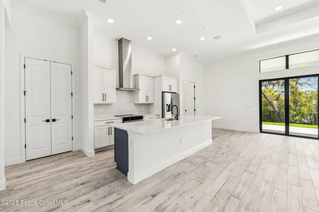 a kitchen with stainless steel appliances granite countertop a stove and a sink