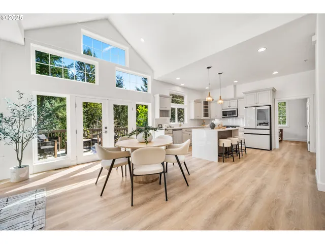 a dining room with furniture and wooden floor