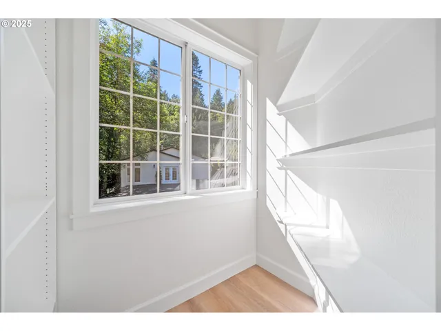 a view of an empty room with a window