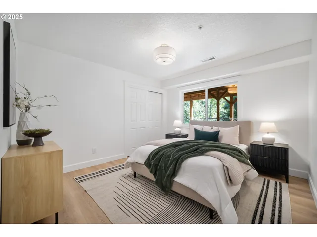 a bedroom with a bed and window