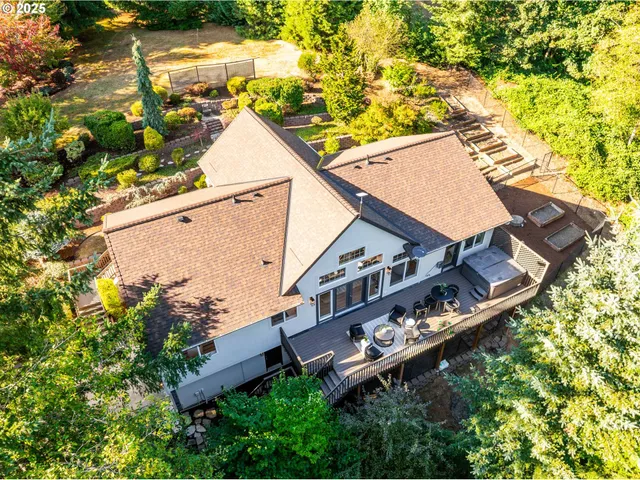 an aerial view of house with yard
