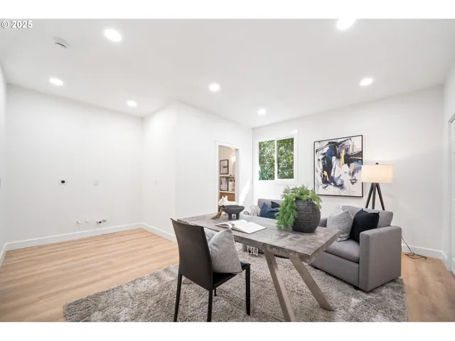 a bathroom with a granite countertop sink a toilet and a mirror