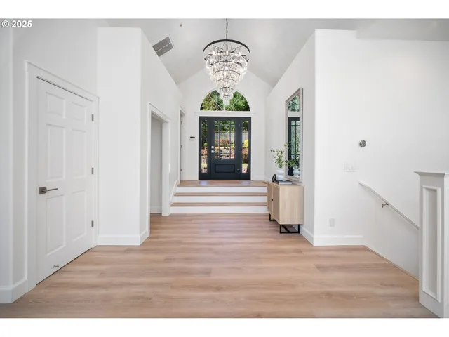 a view of entryway with wooden floor