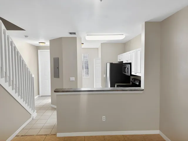 a view of a living room with a flat screen tv