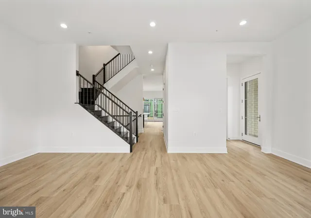 a view of entryway with wooden floor