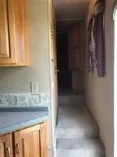 a kitchen with a refrigerator and cabinets