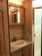 a bathroom with a sink and a mirror
