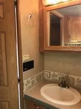 a bathroom with a sink and a mirror
