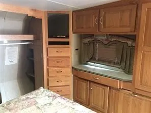 a kitchen with stainless steel appliances granite countertop a refrigerator and a stove