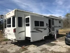 a view of a white house with many windows