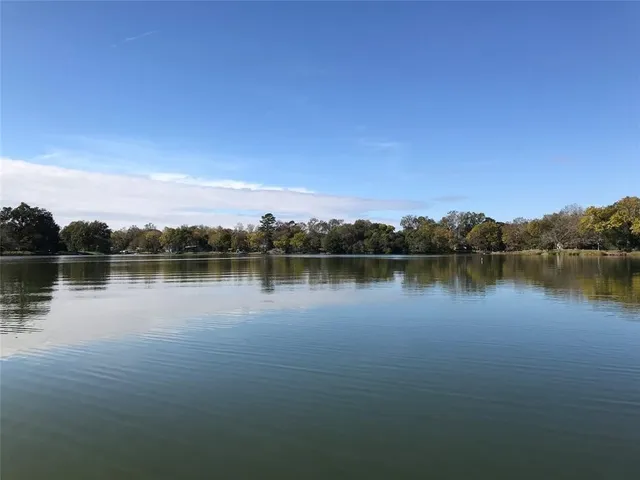 a view of lake with green space