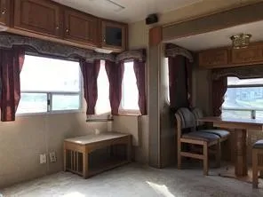 a kitchen with table and chairs
