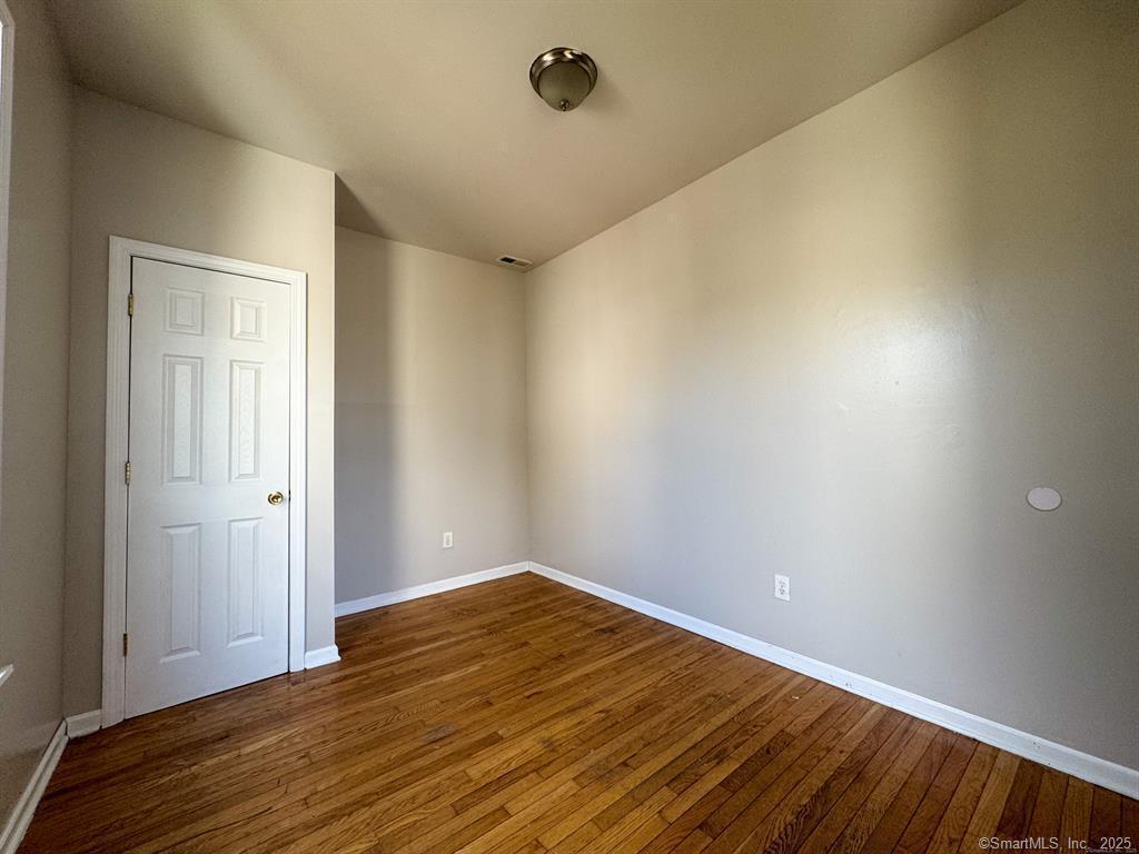40 Jane Street Bridgeport, CT 06608 - Photo 20 of 29 a view of empty room with wooden floor