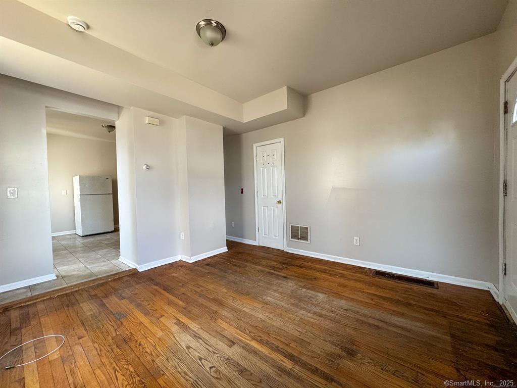 40 Jane Street Bridgeport, CT 06608 - Photo 9 of 29 a view of an empty room and wooden floor