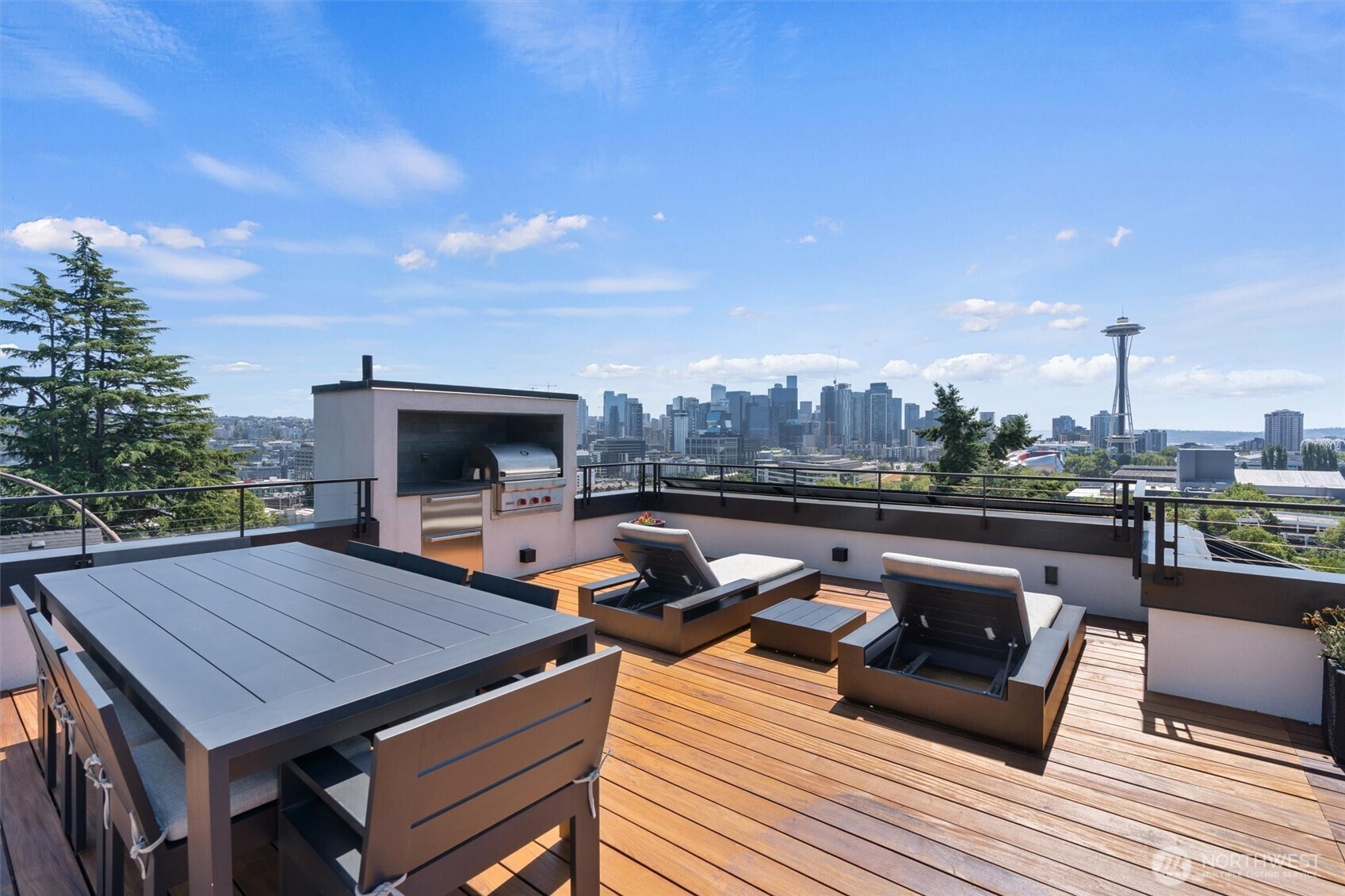 362 Ward Street Seattle, WA 98109 - Photo 5 of 40 a view of roof deck with seating space and wooden floor