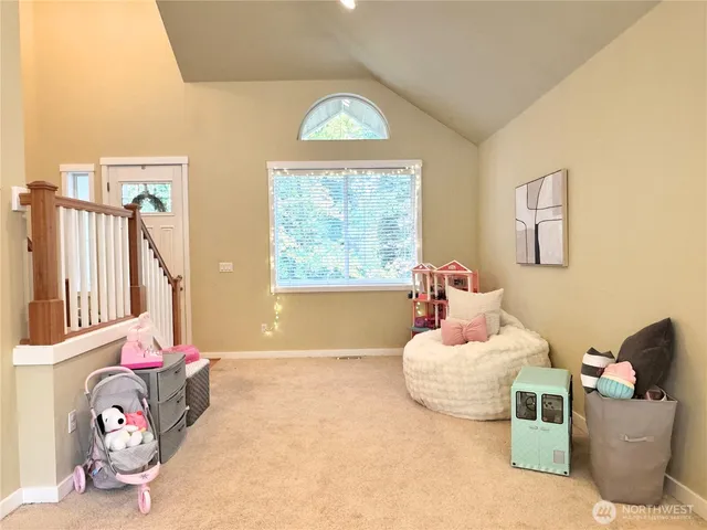 a bedroom with furniture and a window