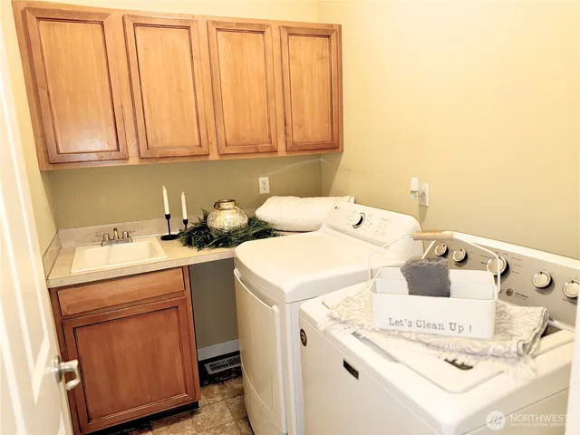 a utility room with dryer and washer