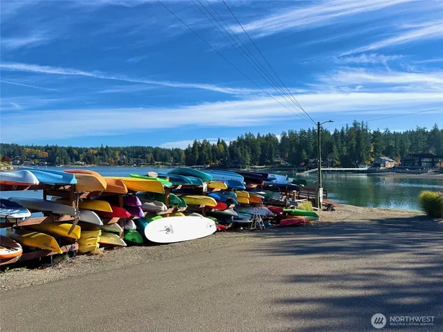 a view of a lake with outdoor seating