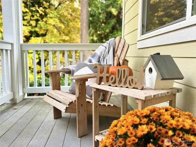 a balcony with table and chairs